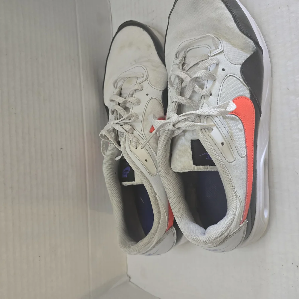White and Black Athletic Shoes with Orange‎ Highlights